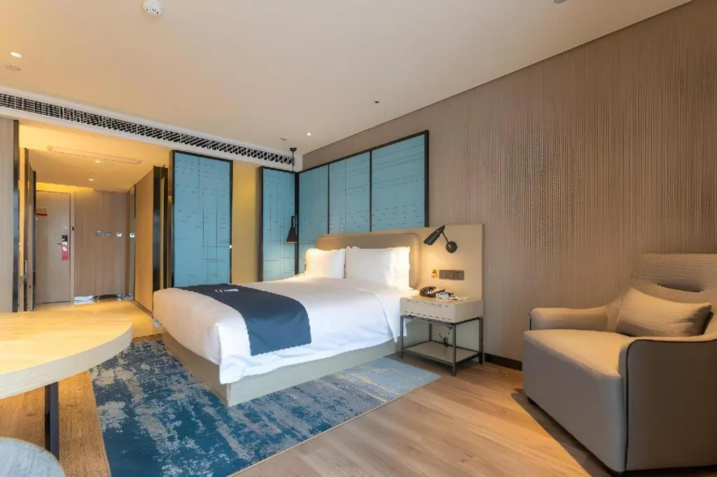 Bed in Echarm Hotel Aegean Shopping Park Zhonghuan Plaza