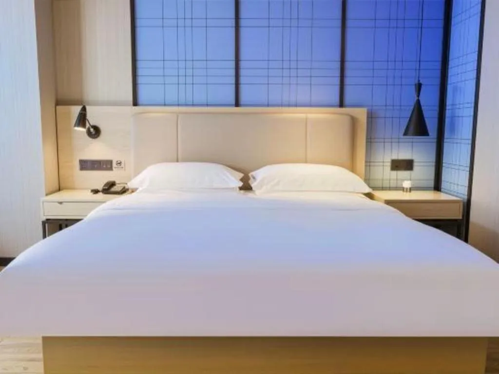 Bed in Echarm Hotel Aegean Shopping Park Zhonghuan Plaza