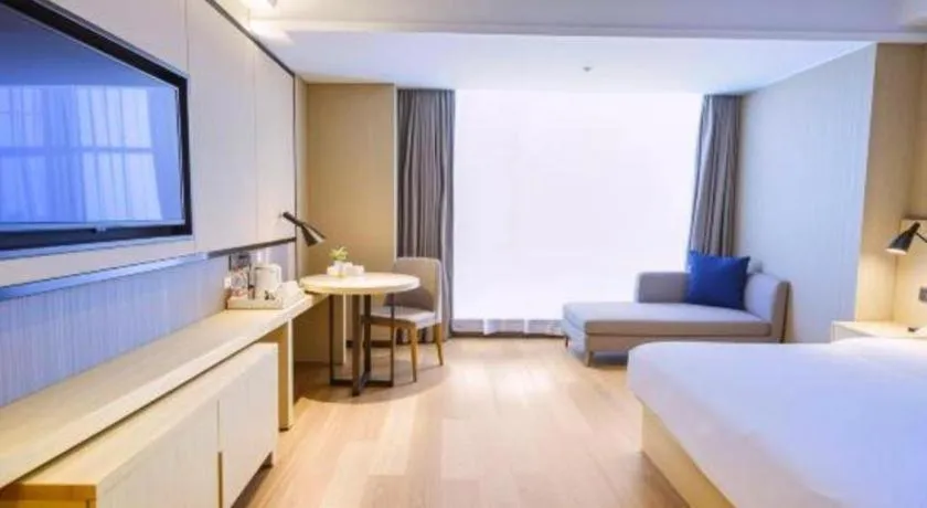 Bed in Echarm Hotel Aegean Shopping Park Zhonghuan Plaza