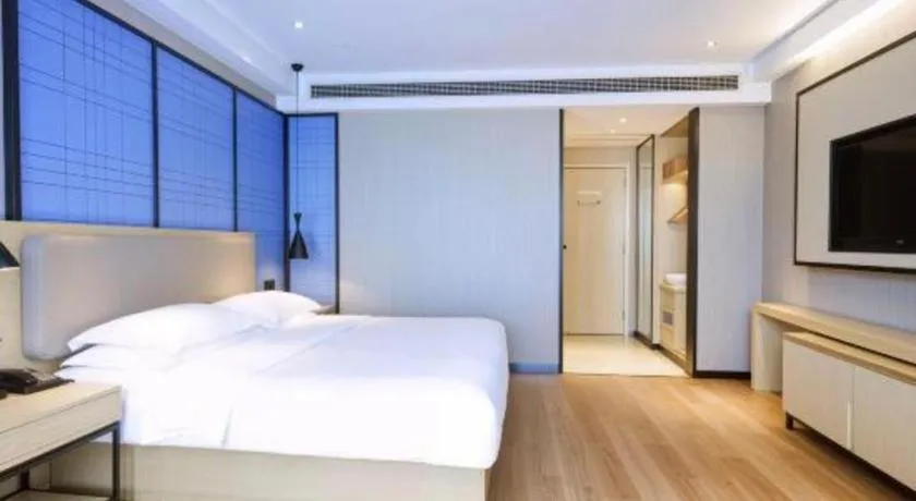 Bed in Echarm Hotel Aegean Shopping Park Zhonghuan Plaza