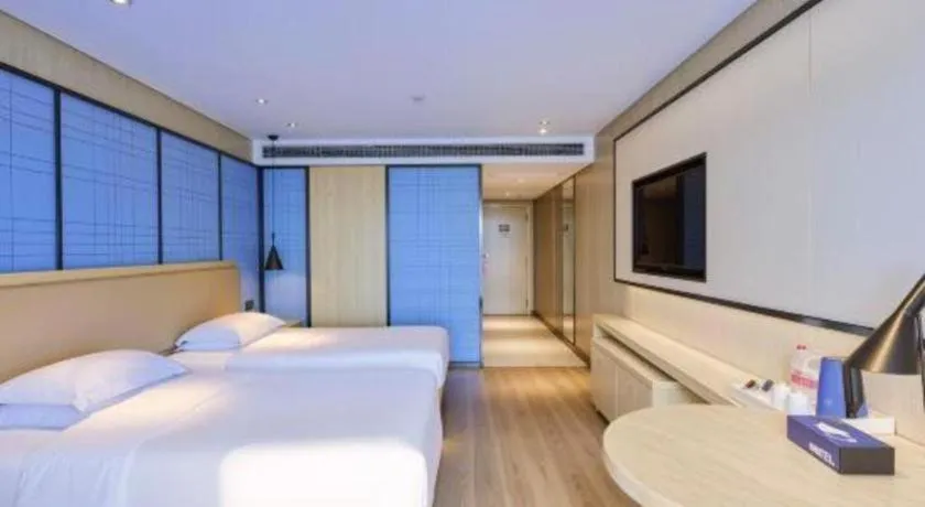 Bed in Echarm Hotel Aegean Shopping Park Zhonghuan Plaza