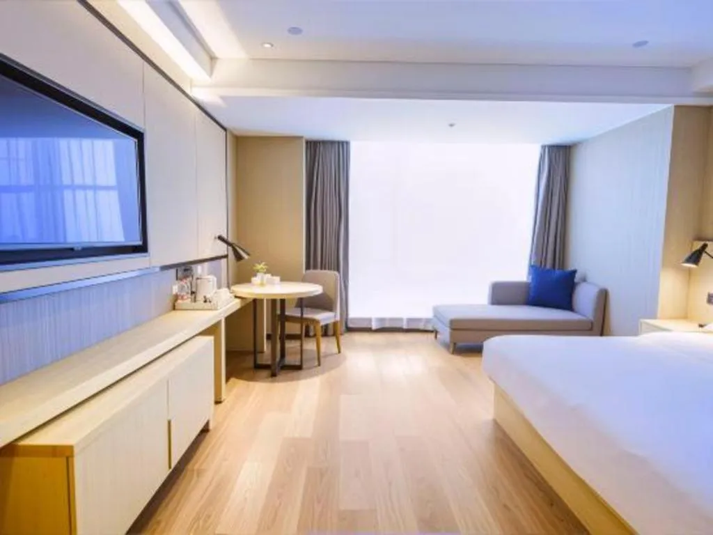 Bed in Echarm Hotel Aegean Shopping Park Zhonghuan Plaza