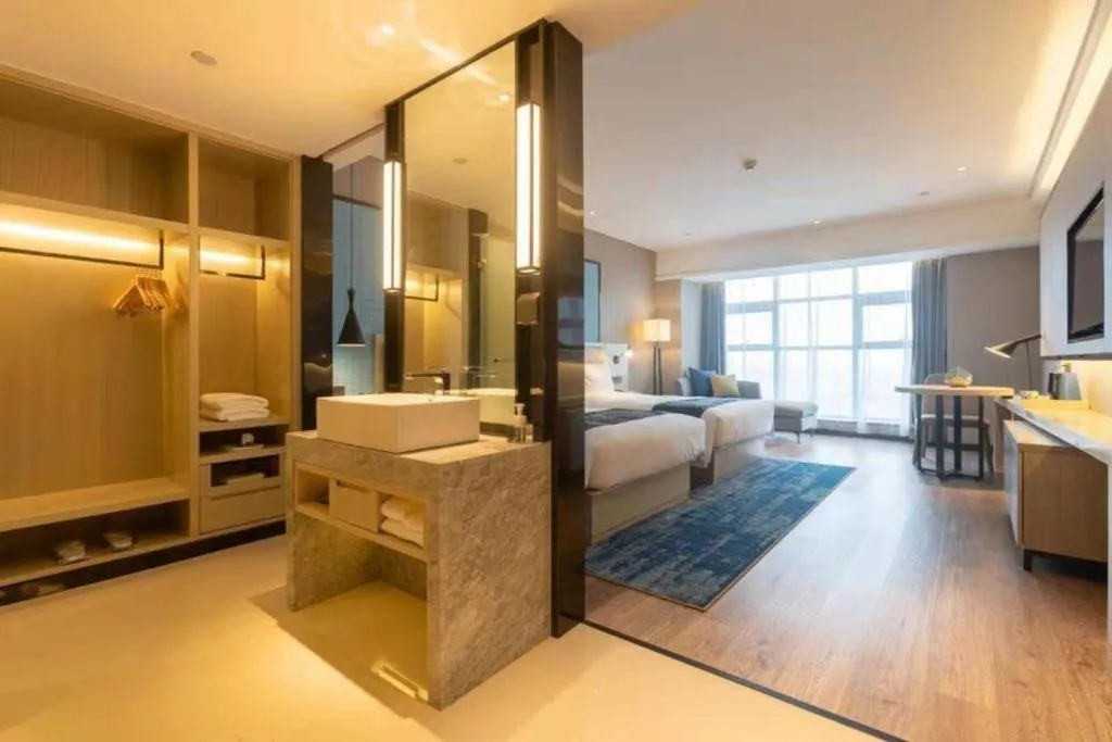 Bed in Echarm Hotel Aegean Shopping Park Zhonghuan Plaza