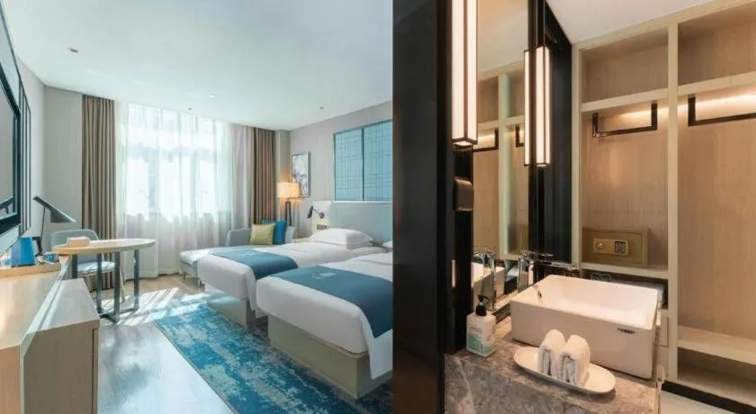 Bed in Echarm Hotel Guangzhou Changlong Shiqiao Metro Station