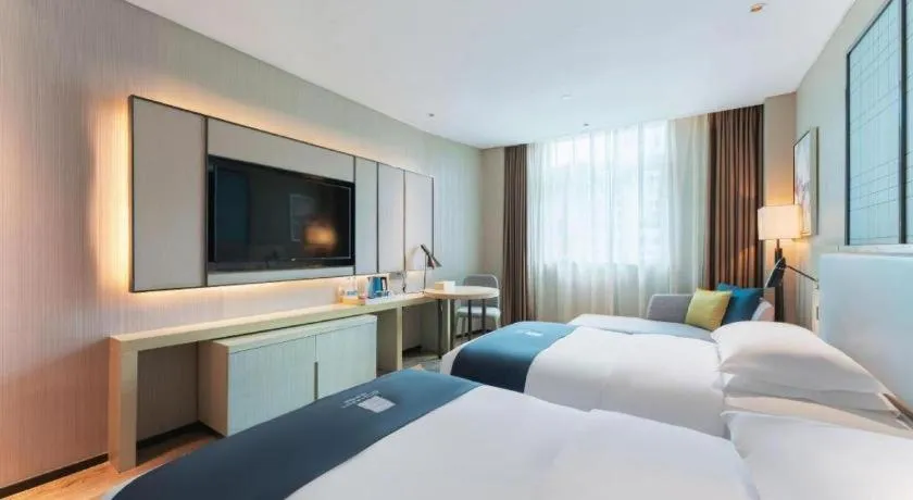 Bed in Echarm Hotel Guangzhou Changlong Shiqiao Metro Station