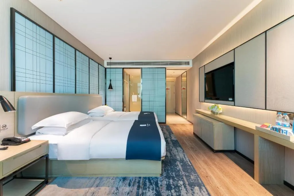 Bed in Echarm Hotel Guangzhou Changlong Shiqiao Metro Station