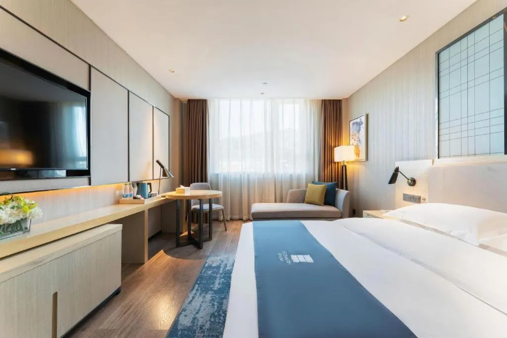 Bed in Echarm Hotel Guangzhou Changlong Shiqiao Metro Station