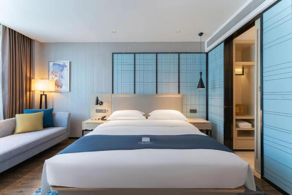 Bed in Echarm Hotel Guangzhou Changlong Shiqiao Metro Station
