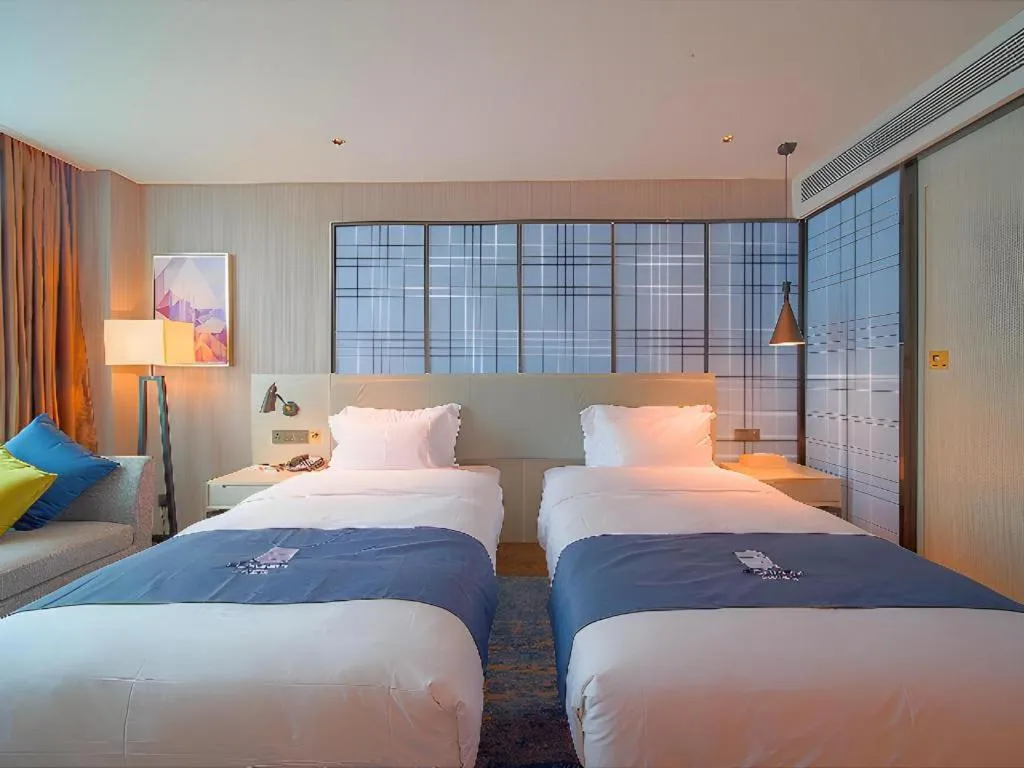 Bed in Echarm Hotel Guangzhou Changlong Shiqiao Metro Station