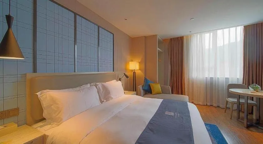 Bed in Echarm Hotel Guangzhou Changlong Shiqiao Metro Station
