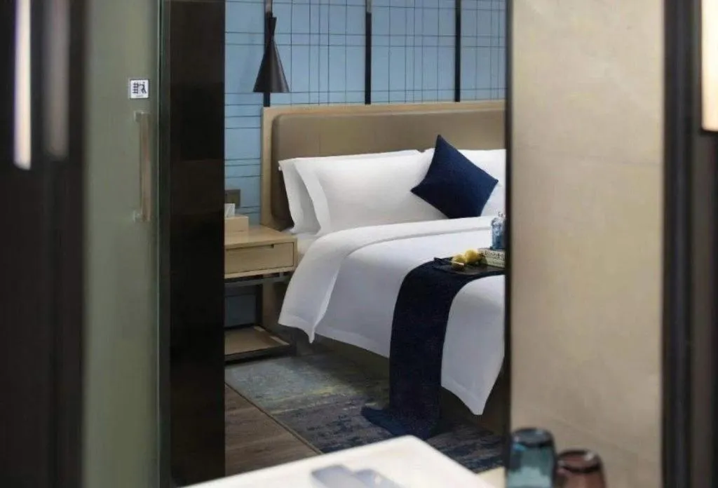 Bed in Echarm Hotel Guangzhou Tonghe Dayuan Times Square