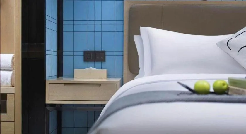 Bed in Echarm Hotel Guangzhou Tonghe Dayuan Times Square