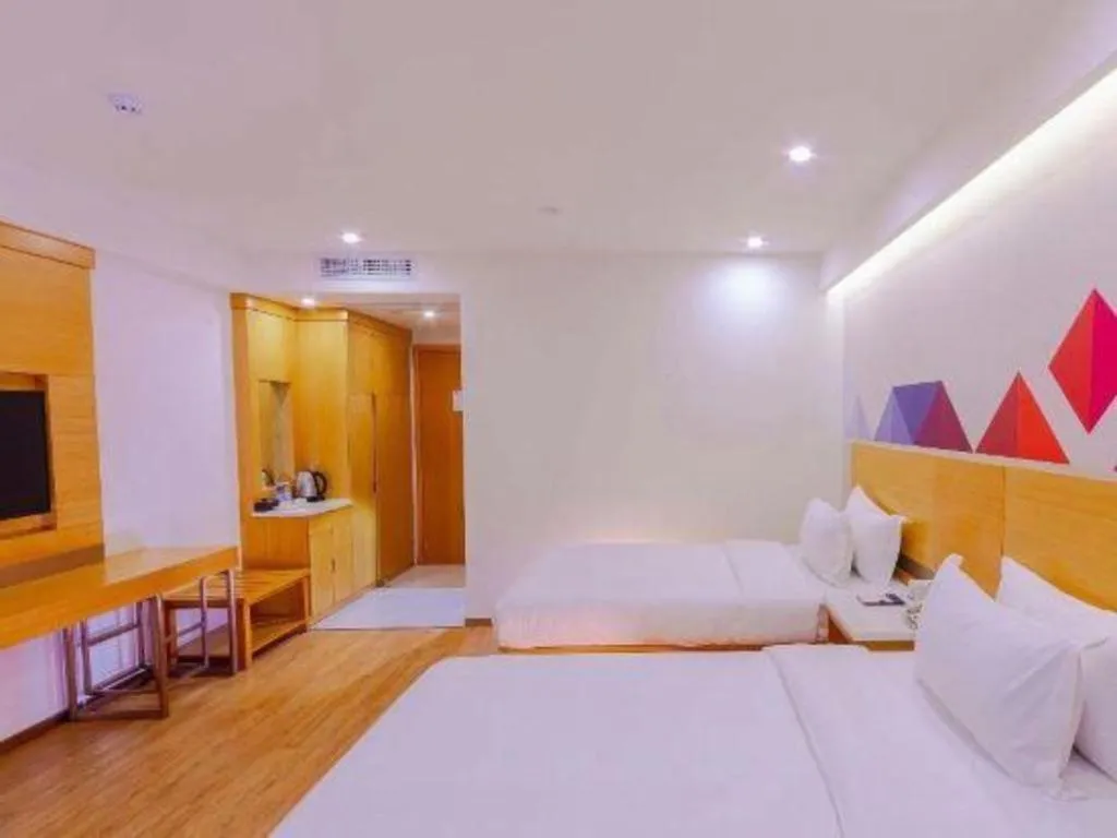 Bed in Borrman Hotel Zhanjiang Shimao Building High-speed Railway Station
