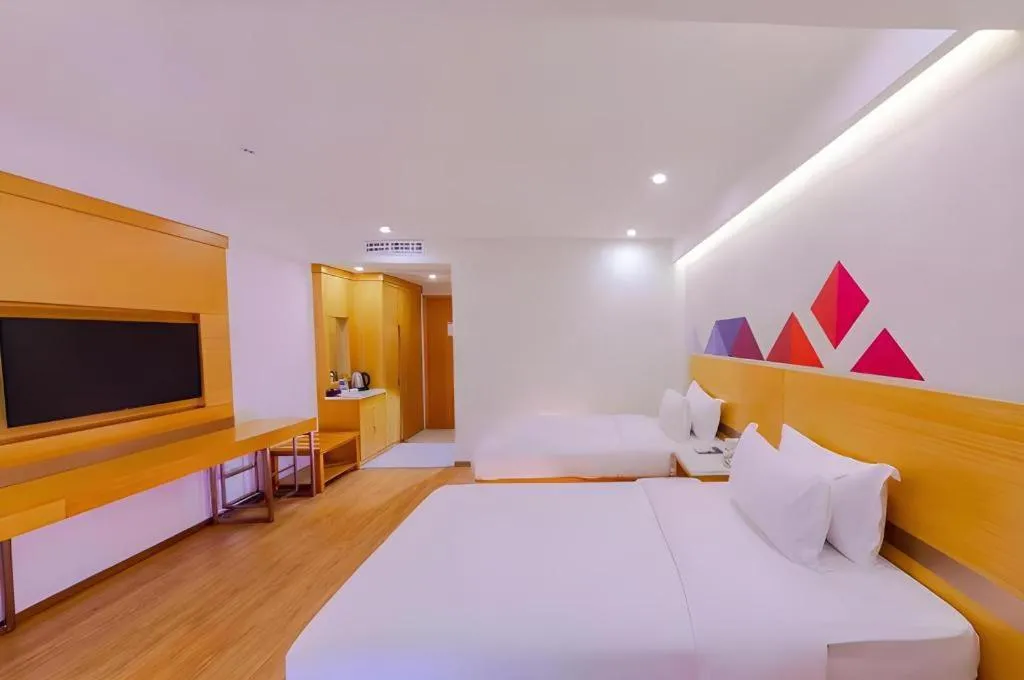 Bed in Borrman Hotel Zhanjiang Shimao Building High-speed Railway Station