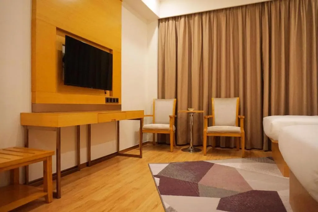 Bed in Borrman Hotel Zhanjiang Shimao Building High-speed Railway Station