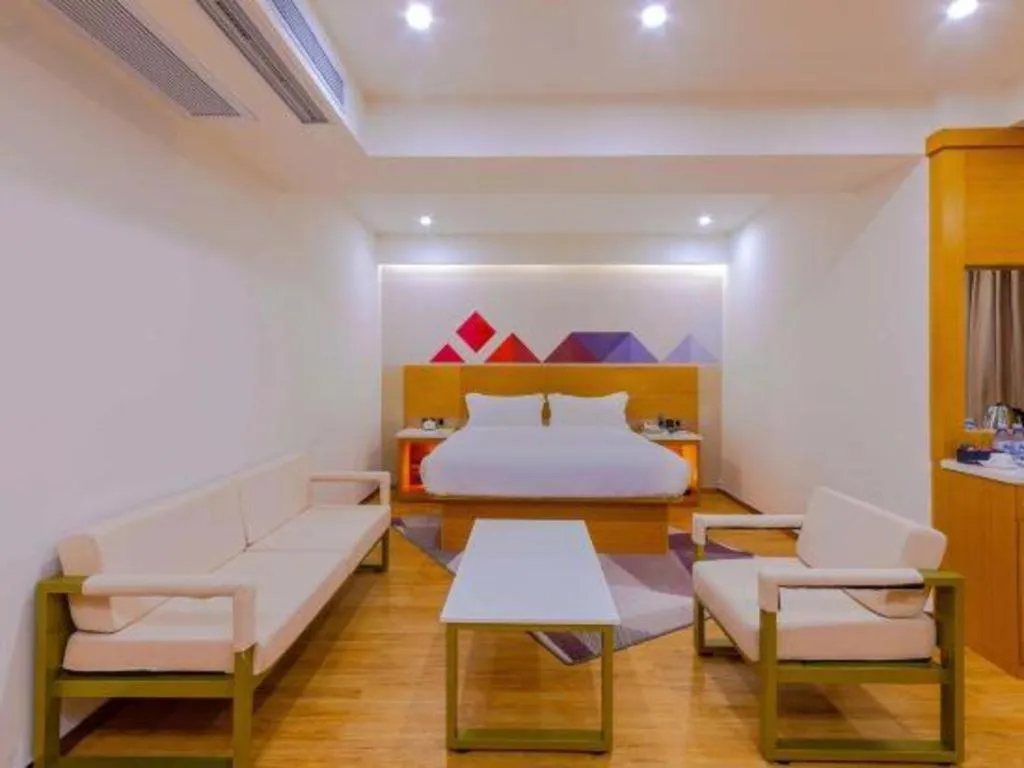 Bed in Borrman Hotel Zhanjiang Shimao Building High-speed Railway Station