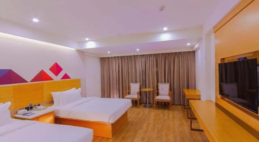 Bed in Borrman Hotel Zhanjiang Shimao Building High-speed Railway Station