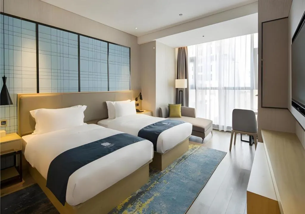 Bed in Echarm Hotel Changsha High-speed Railway Station