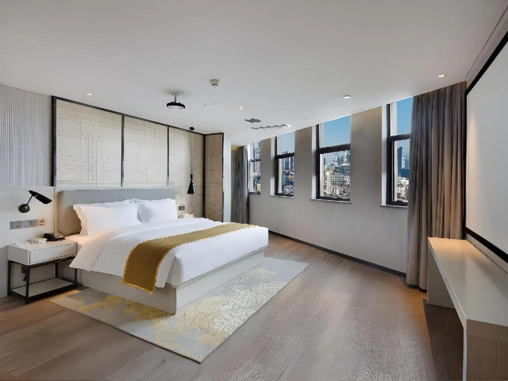 Bed in Echarm Hotel Changsha Guihua Park Metro Station