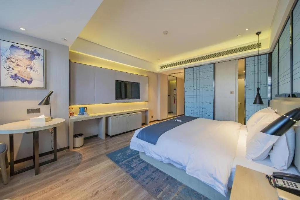 Bed in Echarm Hotel Changsha Guihua Park Metro Station