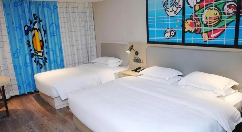 Bed in Echarm Hotel Changsha Guihua Park Metro Station