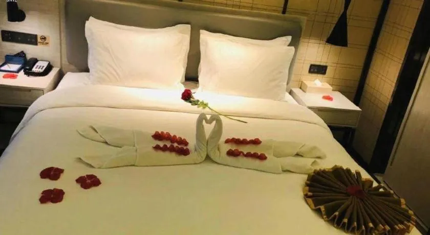 Bed in Echarm Hotel Changsha Guihua Park Metro Station