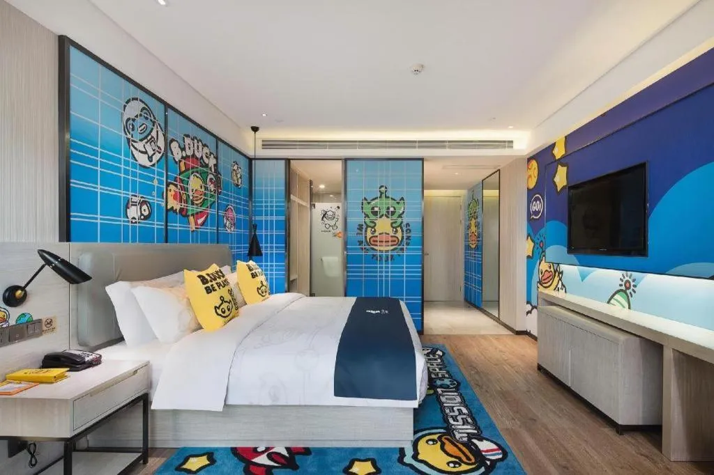 Bed in Echarm Hotel Changsha Guihua Park Metro Station