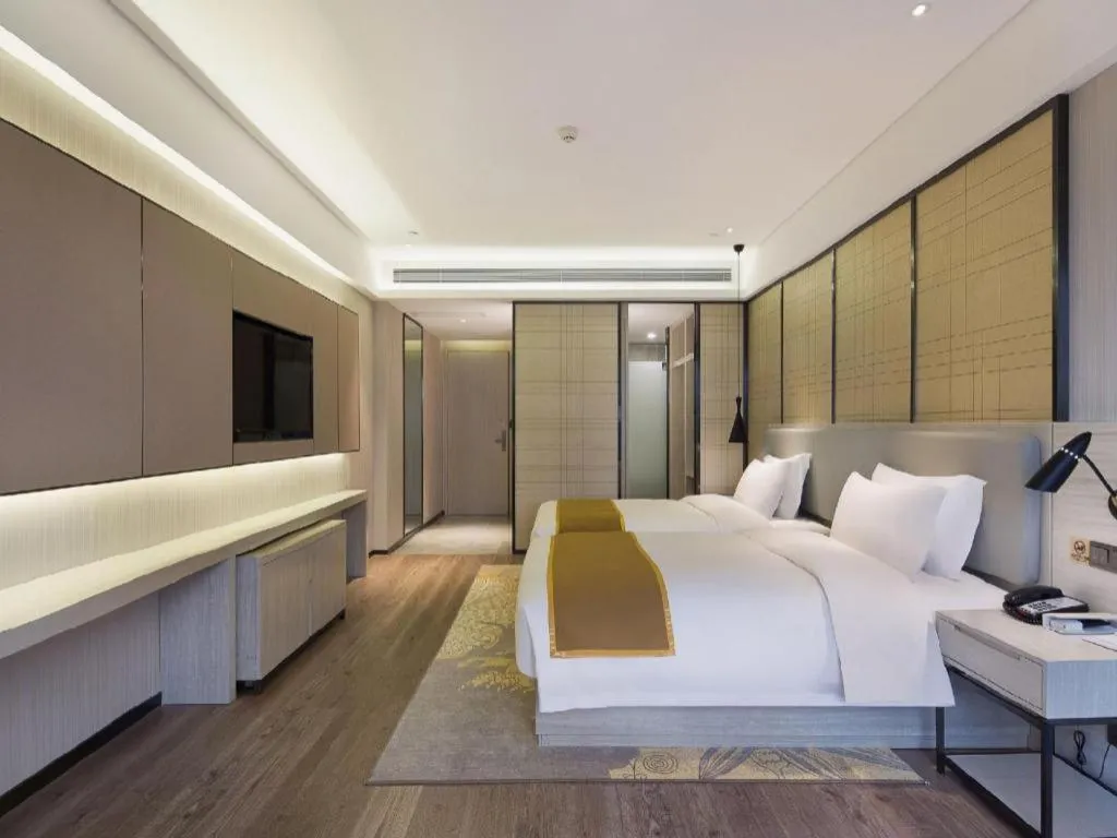 Bed in Echarm Hotel Changsha Guihua Park Metro Station