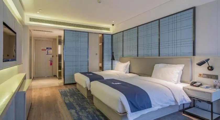 Bed in Echarm Hotel Changsha Guihua Park Metro Station
