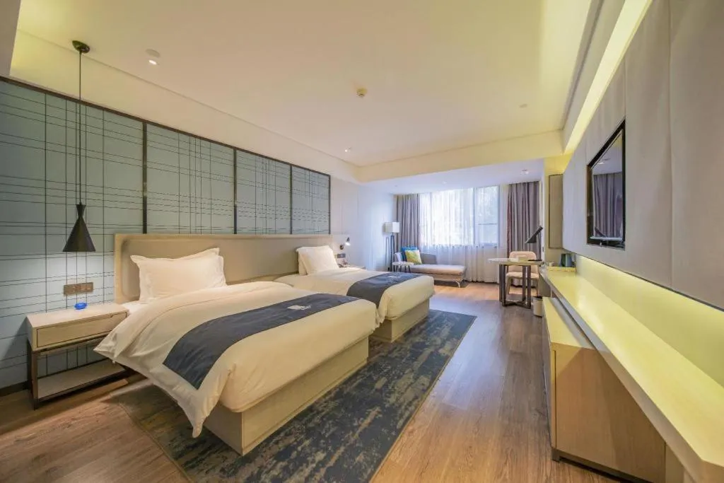 Bed in Echarm Hotel Changsha Guihua Park Metro Station