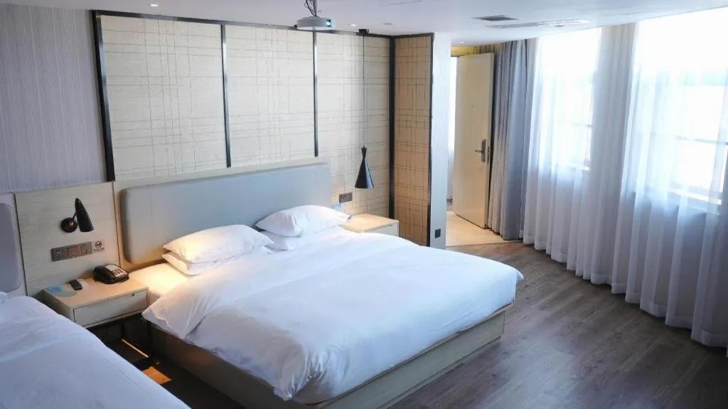 Bed in Echarm Hotel Changsha Guihua Park Metro Station