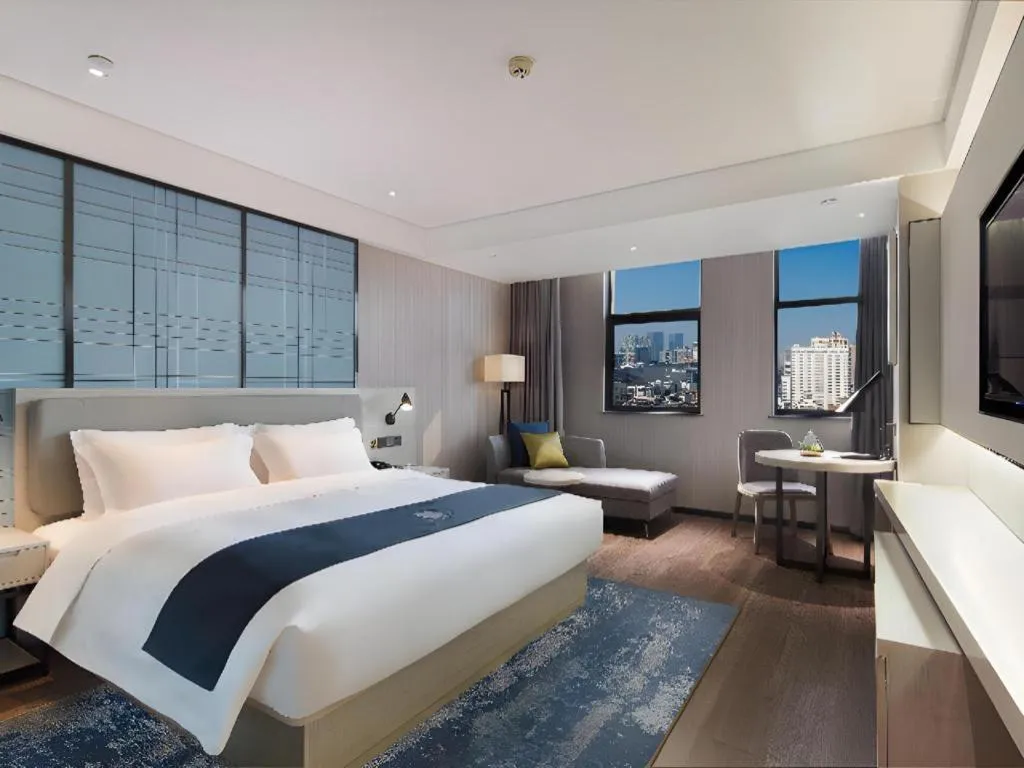 Bed in Echarm Hotel Changsha Guihua Park Metro Station