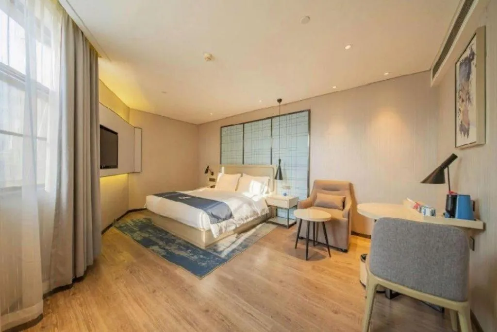 Bed in Echarm Hotel Changsha Guihua Park Metro Station