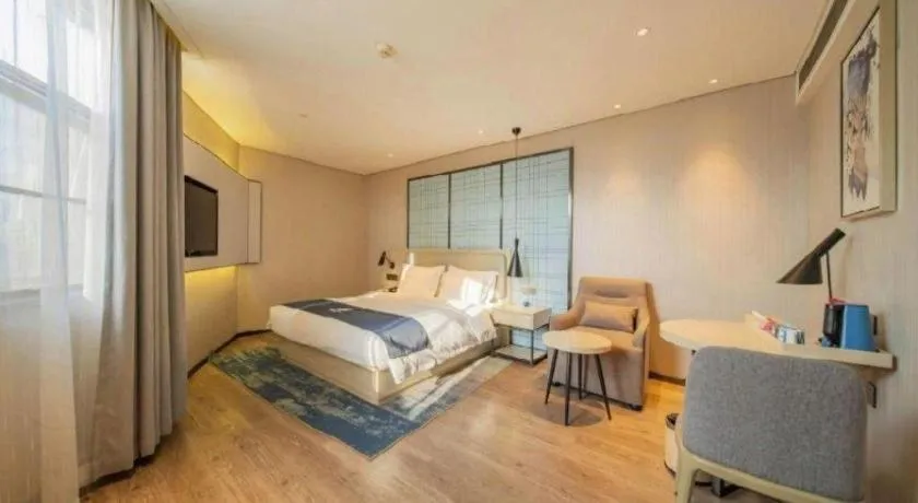 Bed in Echarm Hotel Changsha Guihua Park Metro Station