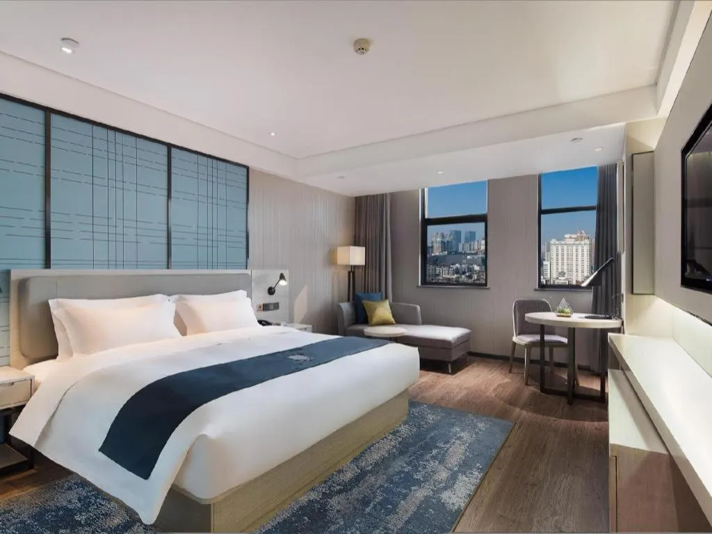 Bed in Echarm Hotel Changsha Guihua Park Metro Station