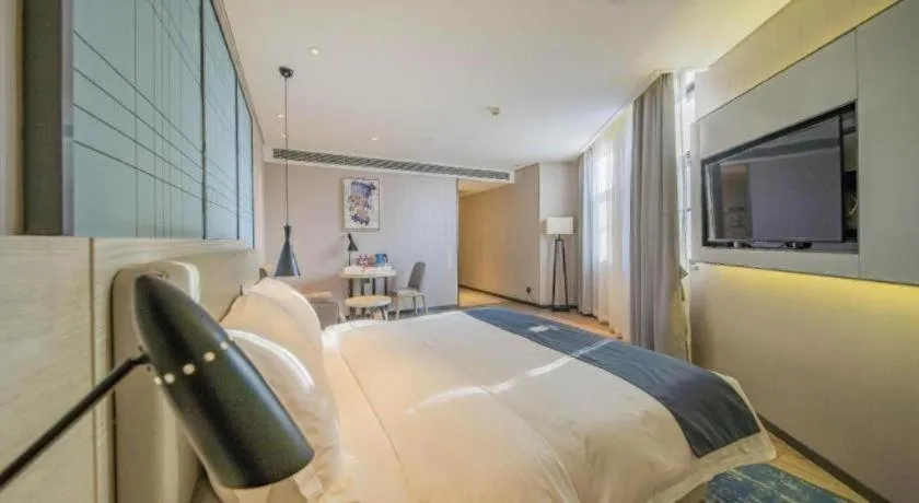 Bed in Echarm Hotel Changsha Guihua Park Metro Station