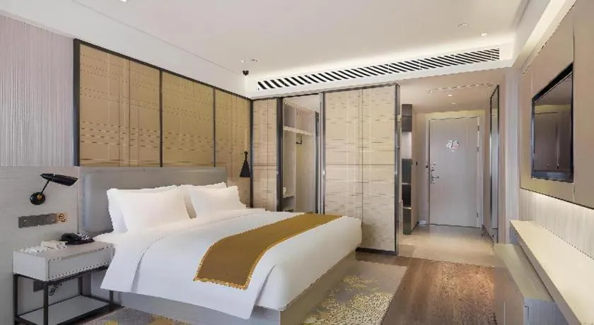Bed in Echarm Hotel Changsha Guihua Park Metro Station