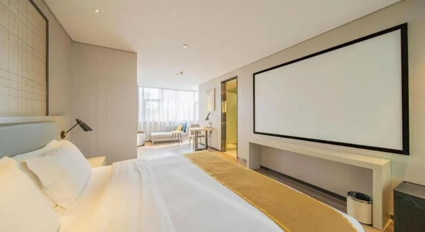 Bed in Echarm Hotel Changsha Guihua Park Metro Station