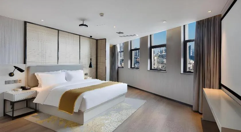 Bed in Echarm Hotel Changsha Guihua Park Metro Station