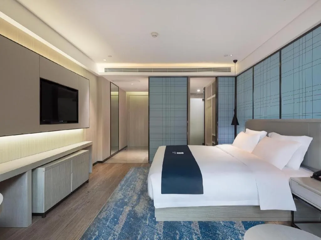 Bed in Echarm Hotel Changsha Guihua Park Metro Station