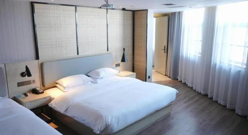 Bed in Echarm Hotel Changsha Guihua Park Metro Station