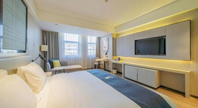 Bed in Echarm Hotel Changsha Guihua Park Metro Station