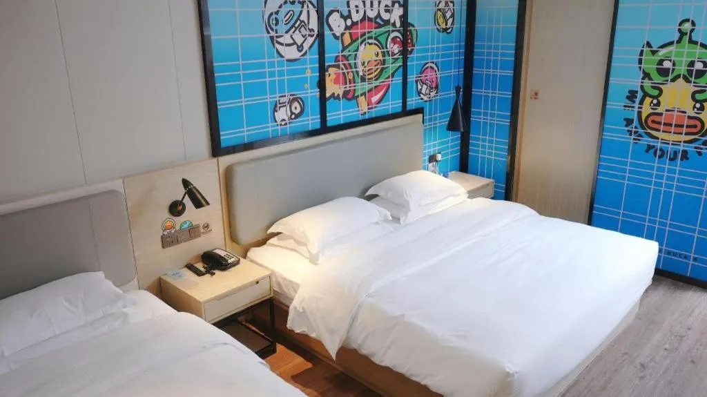 Bed in Echarm Hotel Changsha Guihua Park Metro Station