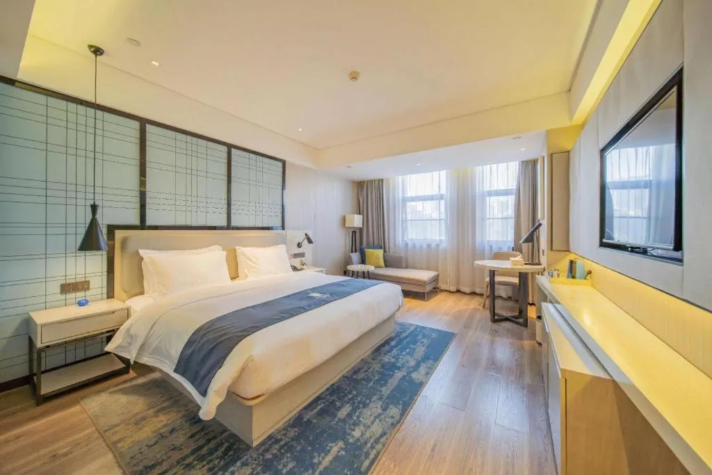 Bed in Echarm Hotel Changsha Guihua Park Metro Station