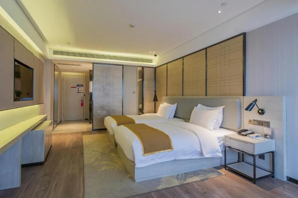 Bed in Echarm Hotel Changsha Guihua Park Metro Station