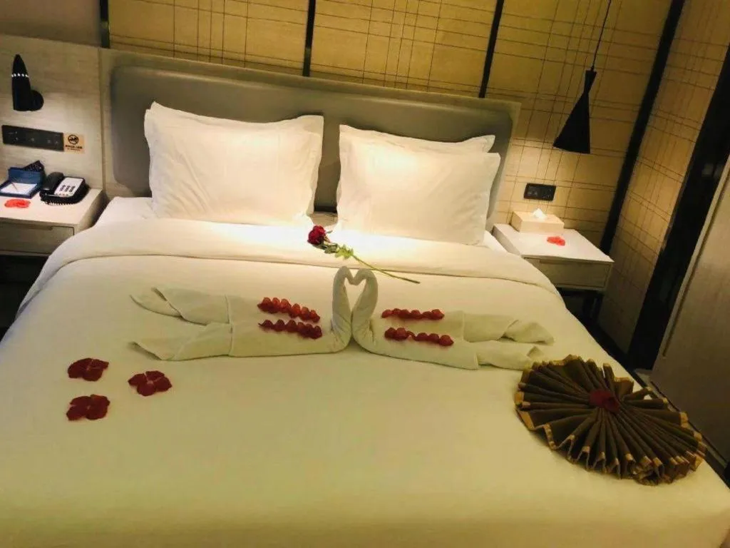 Bed in Echarm Hotel Changsha Guihua Park Metro Station