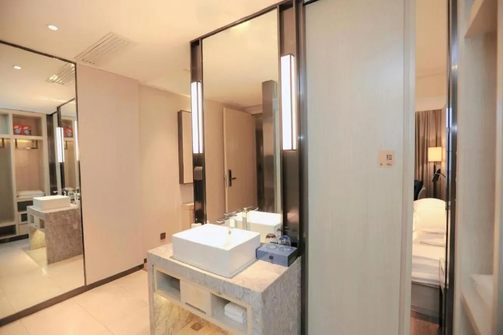 Bed in Echarm Hotel Changsha Guihua Park Metro Station