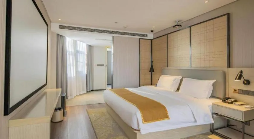 Bed in Echarm Hotel Changsha Guihua Park Metro Station