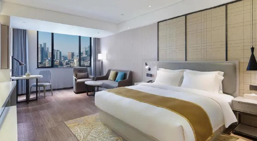 Bed in Echarm Hotel Changsha Guihua Park Metro Station