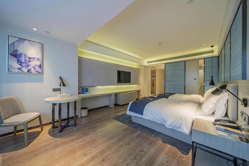 Bed in Echarm Hotel Changsha Guihua Park Metro Station